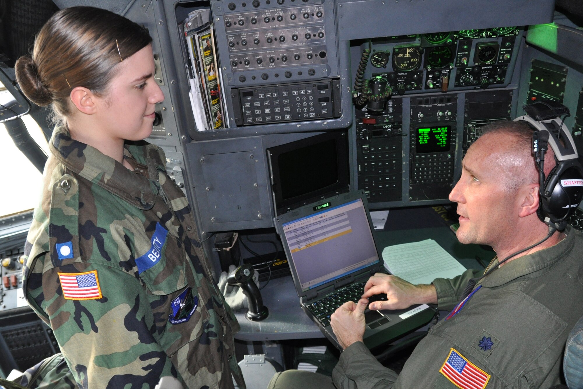 Air Force Reserve Lt. Col. Jeff Shaffer, a C-130 navigator with the 910th Airlift Wing, talks with Cadet 2d Lt. Megan Beatty while he inputs a flight plan here Feb. 22.  Beatty along with approximately 15 other Civil Air Patrol cadets participated in a three-hour orientation flight aboard a C-130 Hercules as part of their entitlements of serving in the Air Force’s official auxiliary.  These cadets are some of the approximately 100-member unit known as Composite Squadron 051 that meets weekly here. For more information about the Civil Air Patrol visit http://www.youngstown.afrc.af.mil/units/civilairpatrol%28CAP%29/index.asp.

