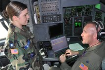 Air Force Reserve Lt. Col. Jeff Shaffer, a C-130 navigator with the 910th Airlift Wing, talks with Cadet 2d Lt. Megan Beatty while he inputs a flight plan here Feb. 22.  Beatty along with approximately 15 other Civil Air Patrol cadets participated in a three-hour orientation flight aboard a C-130 Hercules as part of their entitlements of serving in the Air Force’s official auxiliary.  These cadets are some of the approximately 100-member unit known as Composite Squadron 051 that meets weekly here. For more information about the Civil Air Patrol visit http://www.youngstown.afrc.af.mil/units/civilairpatrol%28CAP%29/index.asp.

