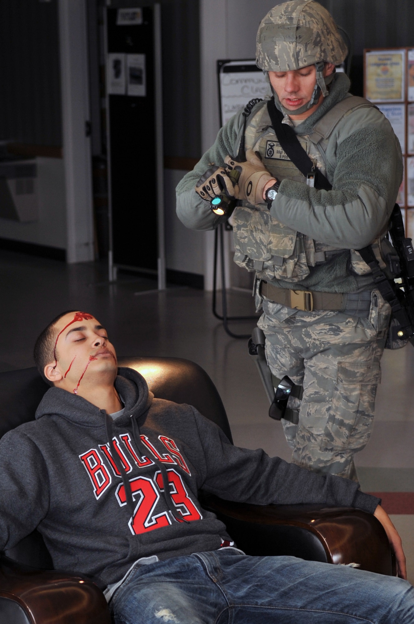 Staff Sgt. Perry Vitali, 51st Security Forces Squadron member, verifies a simulated active shooter is dead after performing a self protection measure known as flick the eyeball, Feb. 22, 2012. Vitali was participating in an Emergency Management Exercise used to practice the roles and precautions of a potential active shooter scenario. (U.S. Air Force photo/Staff Sgt. Craig Cisek)
