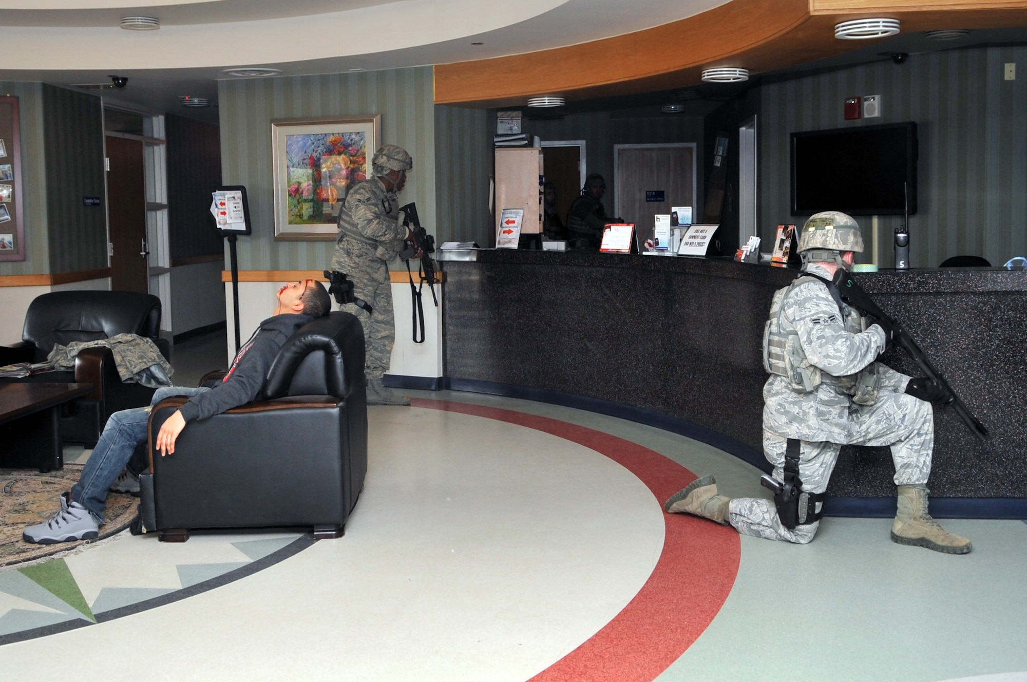 51st Security Forces Squadron Airmen secure the area after a simulated active shooter Emergency Management Exercise here, Feb. 22, 2012. (U.S. Air Force photo/Staff Sgt. Craig Cisek)