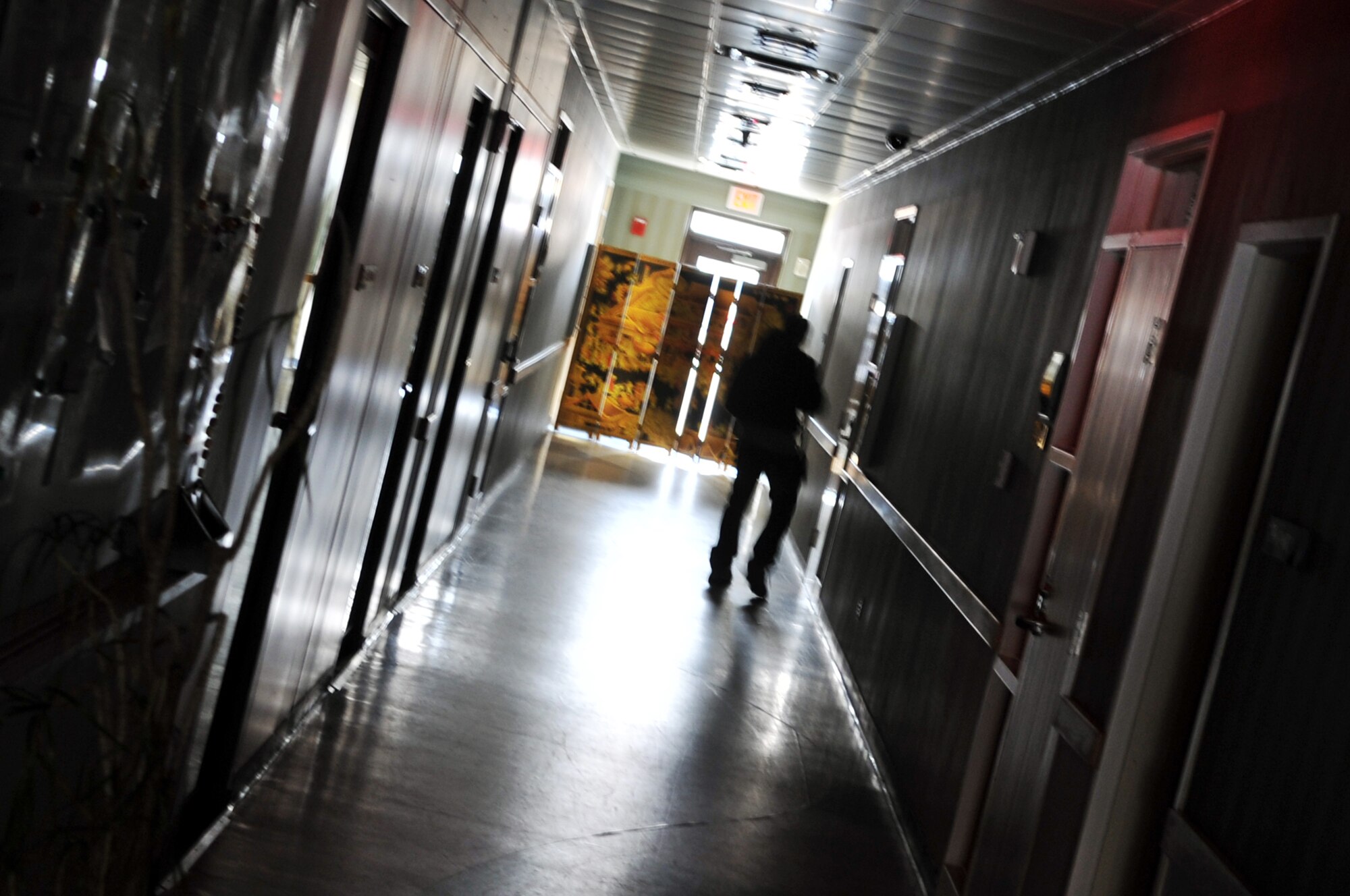 Staff Sgt. Byron Price, 51st Security Forces Squadron member, runs down a hallway to verify there are no additional people located within a barricaded building, Feb. 22, 2012. Price acted as a role player during an Emergency Management Exercise here.  (U.S. Air Force photo/Staff Sgt. Craig Cisek)