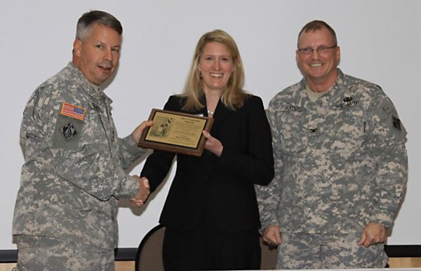 SAVANNAH, Ga. — Maj. Gen. Todd Semonite, Commander of the U.S. Army Corps of Engineers South Atlantic Division, presents Beth Williams with the prestigious Connolly Award at the Savannah E-Week Technical Training Conference, Feb. 22, 2012. Right: Col. Jeff Hall, USACE Savannah District Commander and SAME Savannah Post President.
