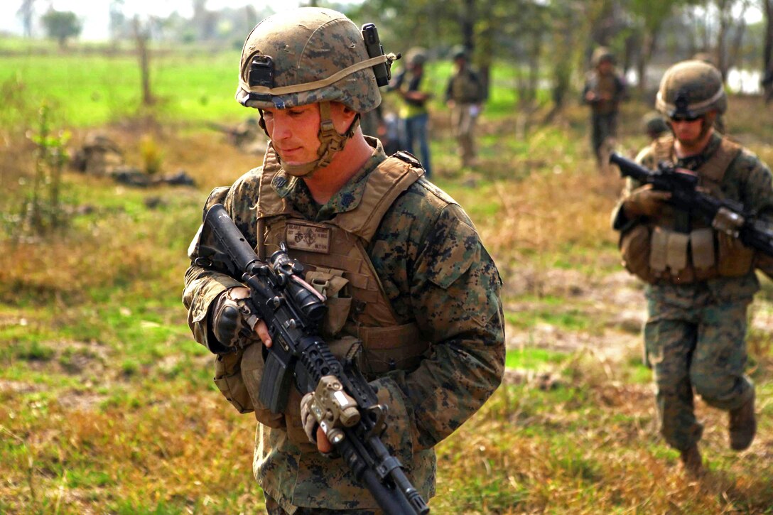 U.S. Marines move to a different assault position with Royal Thai Marines during a bilateral combined arms live-fire exercise during Exercise Cobra Gold 2012 in Muang Kom, Thailand, Feb. 15, 2012.