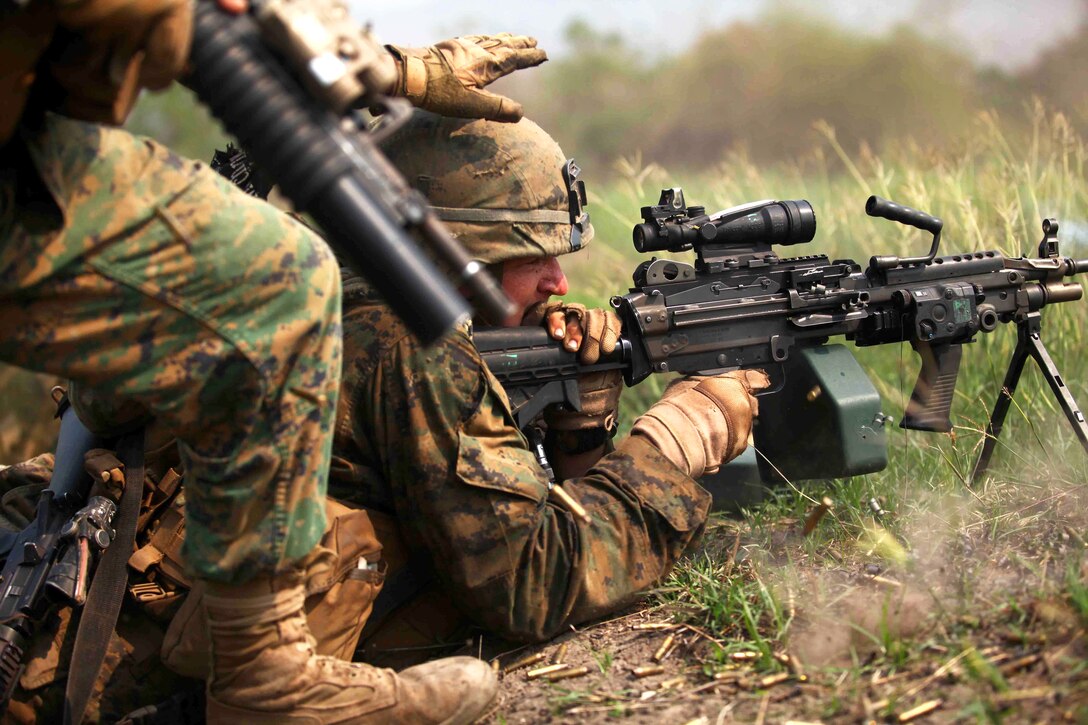 A U.S. Marine operates an M249 squad automatic weapon during a bilateral combined arms live-fire exercise during Exercise Cobra Gold 2012 in Muang Kom, Thailand, Feb. 15, 2012.