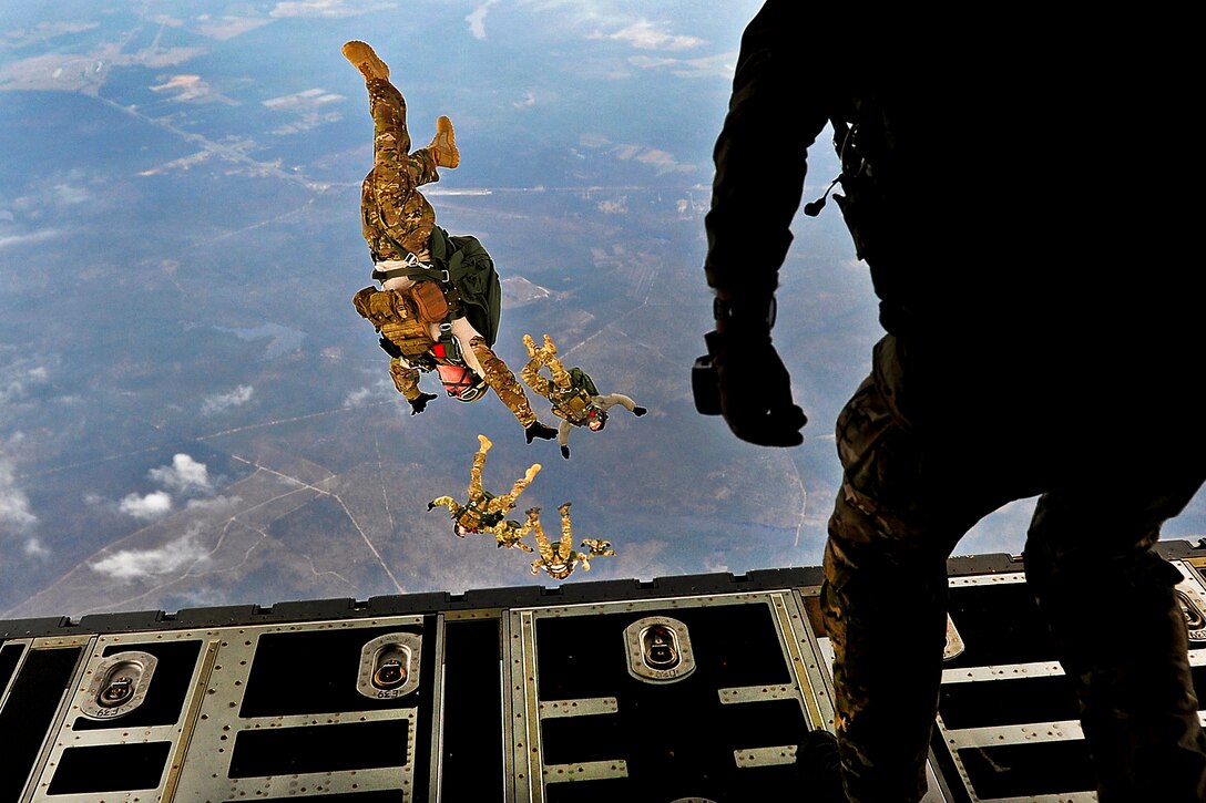 Airmen perform a high-altitude, low-opening jump during a joint operational access exercise on Pope Field, N.C., Feb. 10, 2012. The airmen are combat controllers assigned to the 21st Special Tactics Squadron.