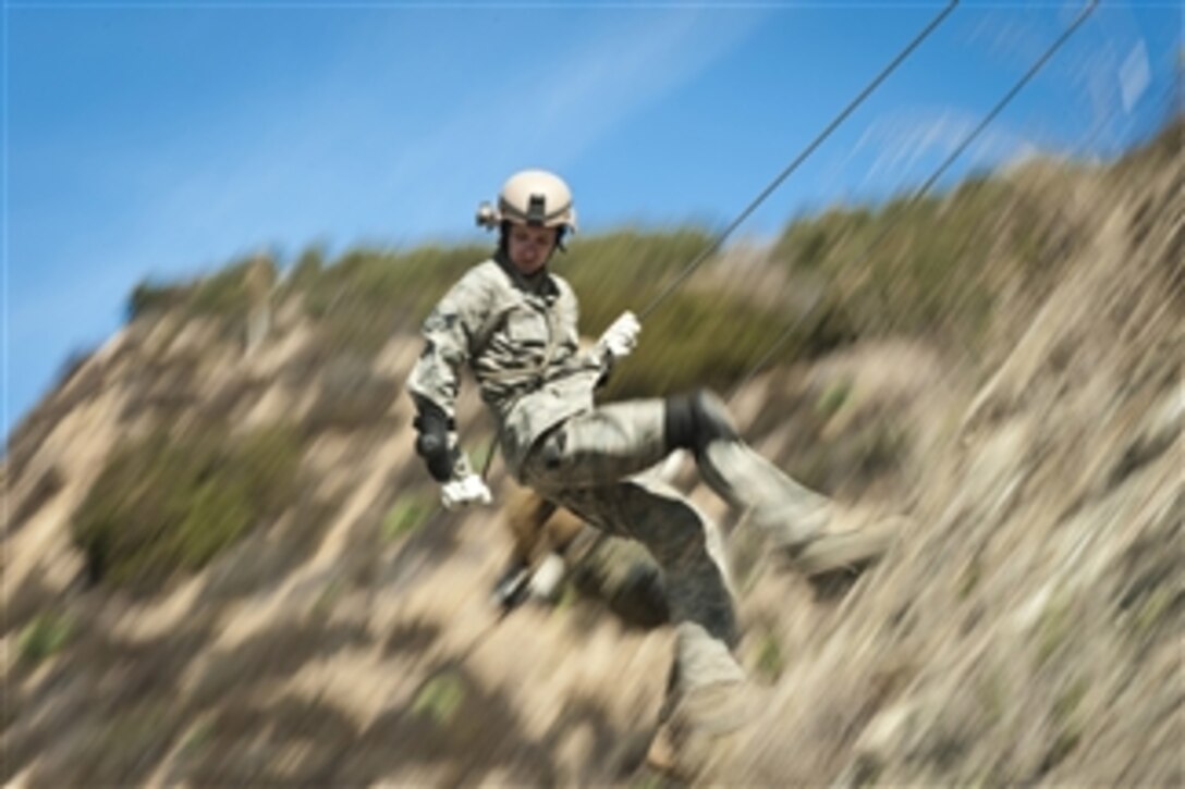 U.S. Air Force Senior Airman Joshua Roberts, assigned to the 4th Combat Camera Squadron, practices rappelling during a field training exercise at Winter Quick Shot 2012 in Azusa, Calif., on Feb. 16, 2012.  Quick Shot is a semi-annual field exercise designed to train combat camera personnel to operate in a combat environment.  