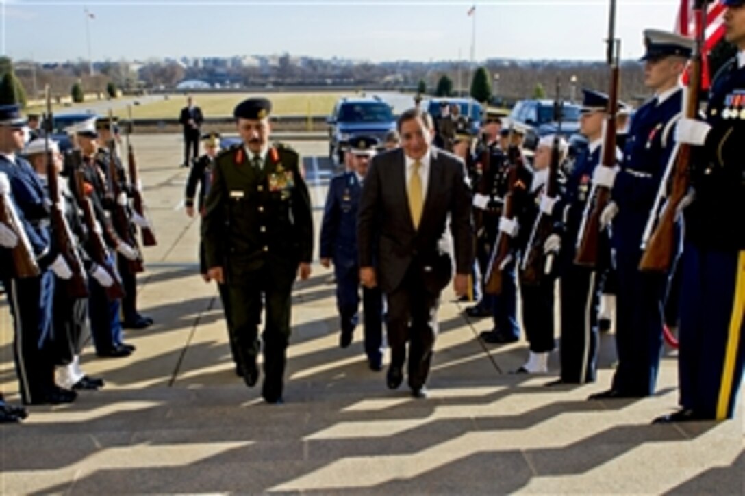 U.S. Defense Secretary Leon E. Panetta escorts Lt. Gen. Mashal al-Zaben, Jordan's chairman of Joint Chiefs of Staff, left, and Jordan’s Lt. Gen. Prince Feisal bin al Hussein, back center, through an honor cordon into the Pentagon, Feb. 23, 2012.