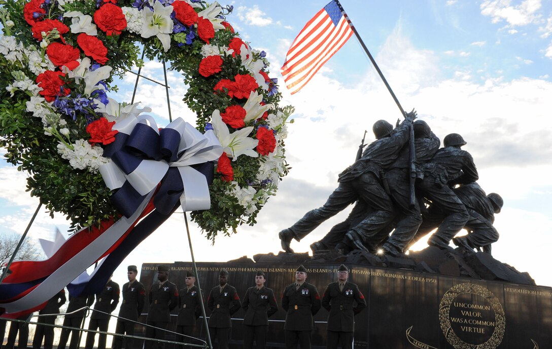 On the 67th Anniversary of the flag raising over Iwo Jima, Henderson Hall Marines stand at attention during the wreath laying ceremony in remembrance of the Marines who gave their lives for our country Feb. 23, 2012. The Commanding Officer of H&S Bn, HQMC, Henderson Hall, Col. Ira M. Cheatham lays the wreath at the foot of the Marine Corps War Memorial and Sergeant Maj. Joseph M. Davenport III, James P. Donovan, Cpl. USMC (Ret.), Founder, President and Executive Director of the Marine Corps War Memorial Foundation, Steve Cominsky, Director MCWMF and Michael Kessler, Lt. Col. USMC (Ret.) also participated in the ceremony. (USMC photo by Sophia Piellusch, DoD