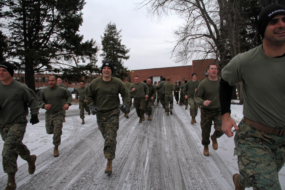 Marines with Recruiting Station Twin Cities' metro offices are all smiles at the start of their Cross Fit workout during an all hands training session Feb. 24. For additional imagery from the event, visit www.facebook.com/rstwincities.