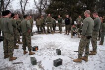 Recruiter Instructor Master Sgt. Michael Reuland discusses Recruiting Station Twin Cities' performance during an all hands physical training session Feb. 24 with the metro offices. For additional imagery from the event, visit www.facebook.com/rstwincities.