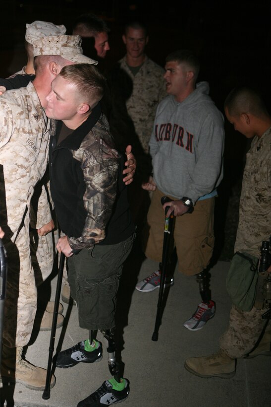 Marines with 2nd Combat Engineer Battalion, 2nd Marine Division, greet Marines from the same unit who came back early from their deployment due to injuries sustained while deployed in Afghanistan. 2nd CEB returned from a seven month deployment Monday.