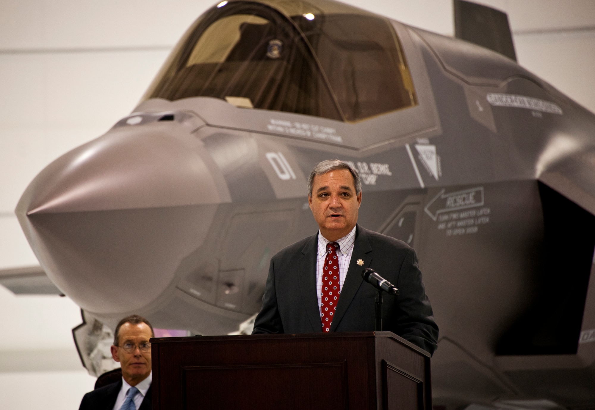 U.S. Congressman Jeff Miller speaks at the Marine Corps F-35B Lightning II roll out ceremony Feb. 24 at Eglin Air Force Base, Fla.  (U.S. Air Force photo/Samuel King Jr.)