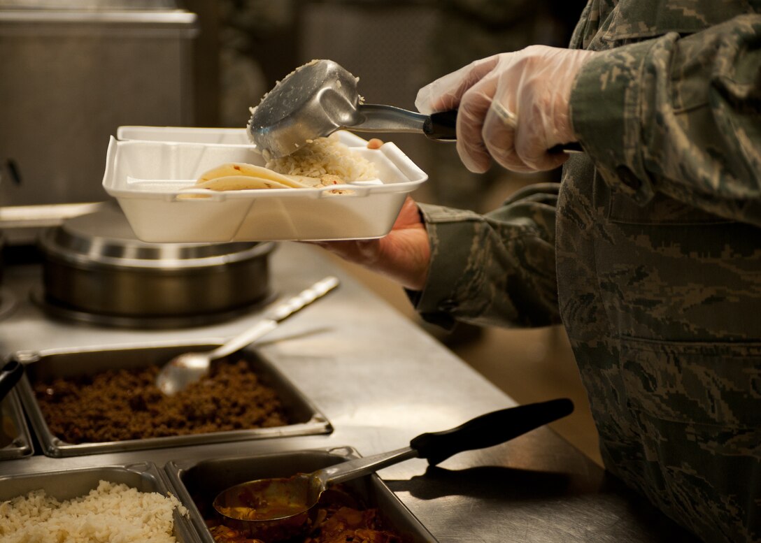 Staff Sgt. Raymond Garcia, 28th Force Support Squadron assistant manager of the flight kitchen, dishes up rice for lunch at the flight kitchen on Ellsworth Air Force Base, S.D., Feb. 14, 2012. The flight kitchen provides Ellsworth personnel with healthy meal options 24 hours a day. (U.S. Air Force photo by Airman Alystria Maurer/Released)