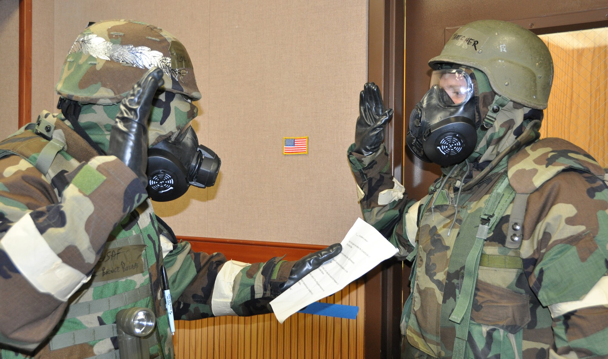 Col. Bruce Bowers, 446th Airlift Wing commander, reenlists Tech. Sgt. Andrew Thatcher, a loadmaster with the 728th Airlift Squadron, during the Operational Readiness Exercise at McChord Field last week.  Thatcher has been with the 446th AW for six years. (U.S. Air Force photo by Lt. Col. Christopher Wallington)