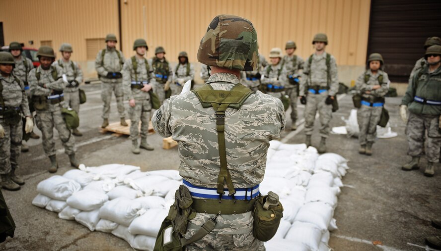 Airmen assigned to “Base X” receive instructions prior to filling sandbags as part of an Operational Readiness Exercise held on Scott AFB Feb. 21-25. Sandbags are used to harden facilities, build bunkers and provide protection to buildings during attacks. The ORE was designed to test the base’s ability to conduct operations in a deployed environment. (U.S. Air Force photo by Staff Sgt. Ryan Crane/Released)
