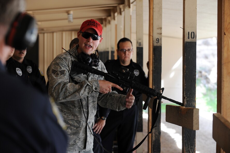 U.S. Air Force Senior Airman Matthew Smith, 7th Security Forces Squadron, demonstrates proper technique during an Air Force qualification Course Feb. 23, 2012, at Dyess Air Force Base, Texas. The new course implements quick reaction with the M-4 carbine and the M-9 beretta. (U.S. Air Force photo by Airman 1st Class Jonathan Stefanko/ Released)