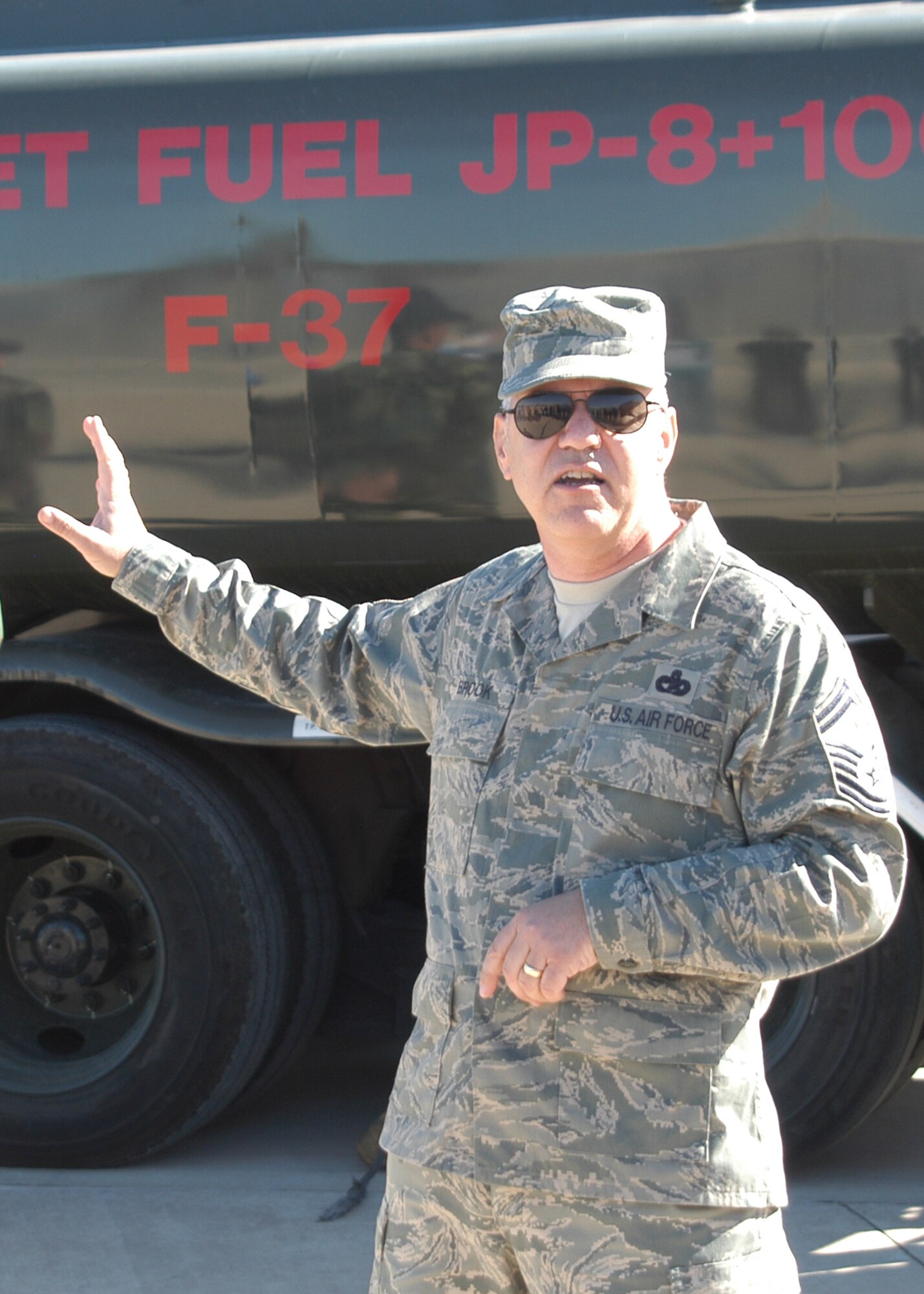 Senior Master Sgt. Steven Brook, 944th logistics Readiness Squadron, transportation manager, explains how jet fuel is transported to a group of local employers during a recent Bosses Day. Brook is the 2011 recipient of the Graydon Williams Award. The award is presented annually to an Air Reserve Technician or Active Guard Reserve member who personifies the character and traits of the late Tech. Sgt. Graydon Williams, a 944th Fighter Wing maintenance ART who died at a young age of cancer. The essence of the award is based on superior performers who do not seek recognition, perform clearly above expectations, and have not been adequately recognized for their overall contributions and impact on the wing. (U.S. Air Force photo)