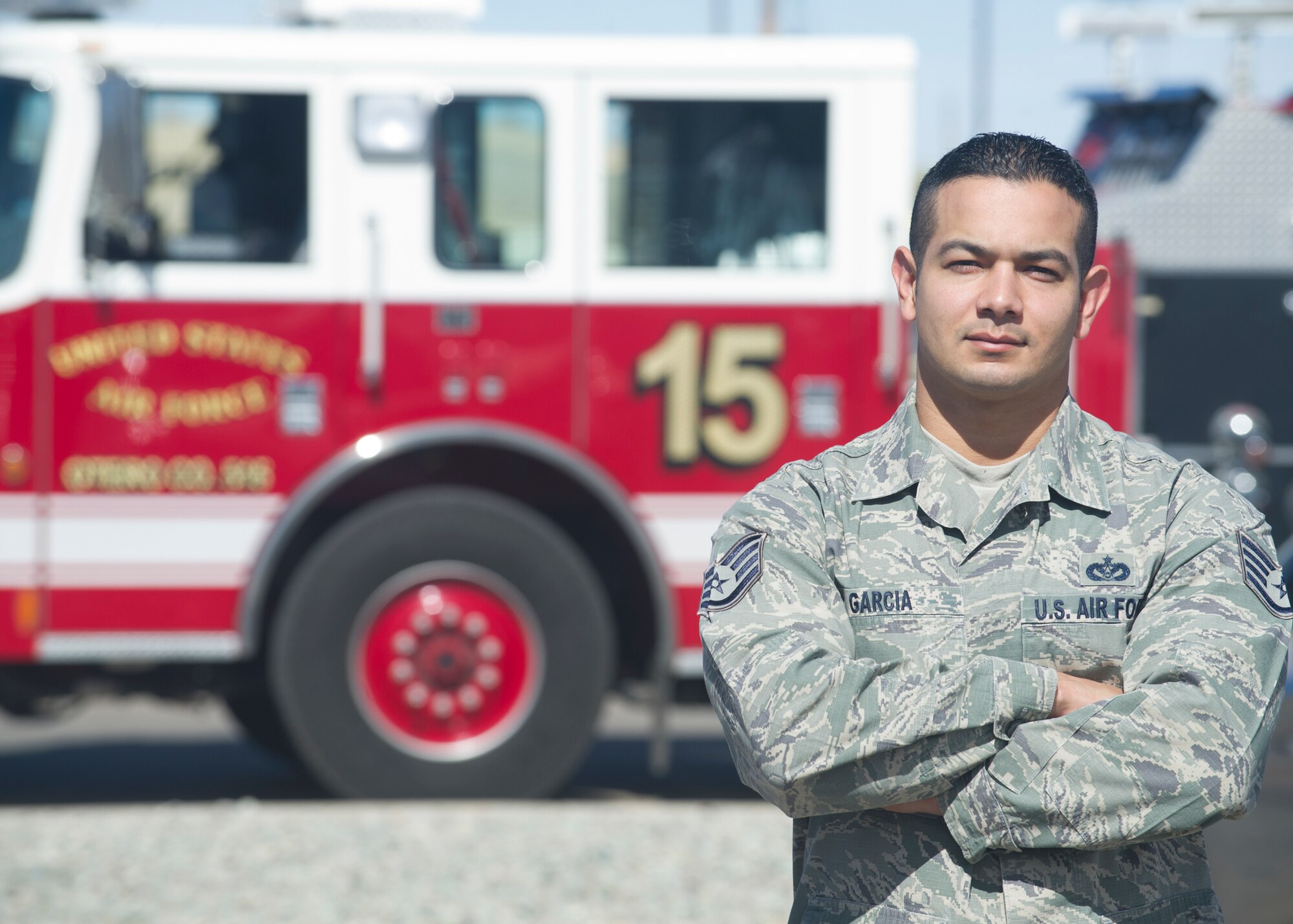 Staff Sgt. Lionel Garcia, a 49th Civil Engineer Squadron firefighter, poses for a photo Feb. 23, at Holloman Air Force Base, N.M. While on leave in San Antonio, Garcia saved the life of a police officer who was struck by a passing motorist Feb. 19. The officer is expected to make a full recovery. Garcia credits his actions to all of the Air Force fire protection training he has received. (U.S. Air Force photo by Senior Airman DeAndre Curtiss/Released)