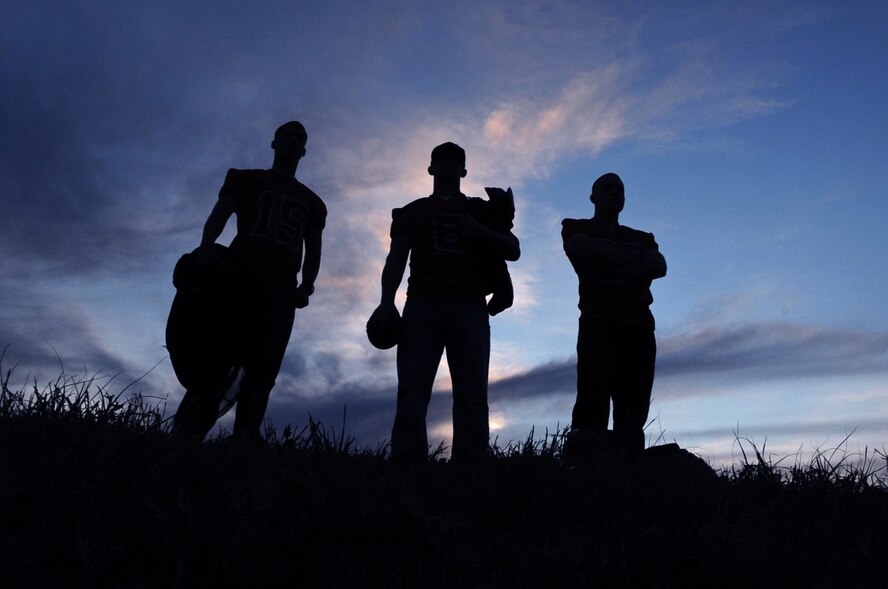 (From left to right) Airman 1st Class Joseph Palacio, Staff Sgt. Robert Hoffman and Staff Sgt. Daniel Wass, 2nd Munitions Squadron, wait for the start of their football practice on Barksdale Air Force Base, La., Feb. 23. Barksdale has four Airmen playing for the Shreveport Bossier Knights, a local minor pro football team. The Knights' first home game will be at 7 p.m.  Feb. 25 at Lee Hedges Stadium in Shreveport. For more information about the Knights visit www.sbknights.org. (U.S. Air Force photo/Airman 1st Class Micaiah Anthony)(RELEASED)
