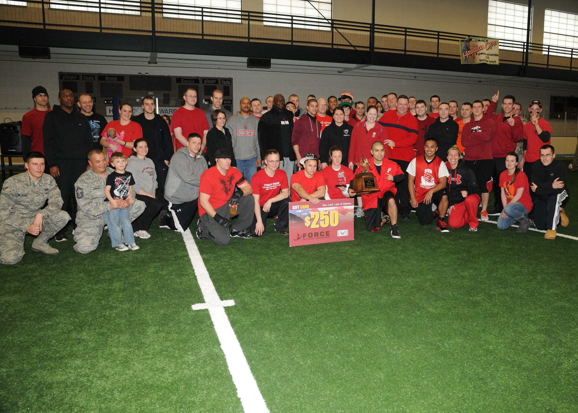 Members of the 319th Civil Engineer Squadron pose after winning the 2012 Winter Bash on Feb. 23, 2012, on Grand Forks Air Force Base, N.D. Hundreds of Airmen and civilians packed the base’s 135,000-square-foot, state of the art fitness center starting at 7:30 a.m. for the event.  (U.S. Air Force photo by Airman 1st Class Ashley Taylor)