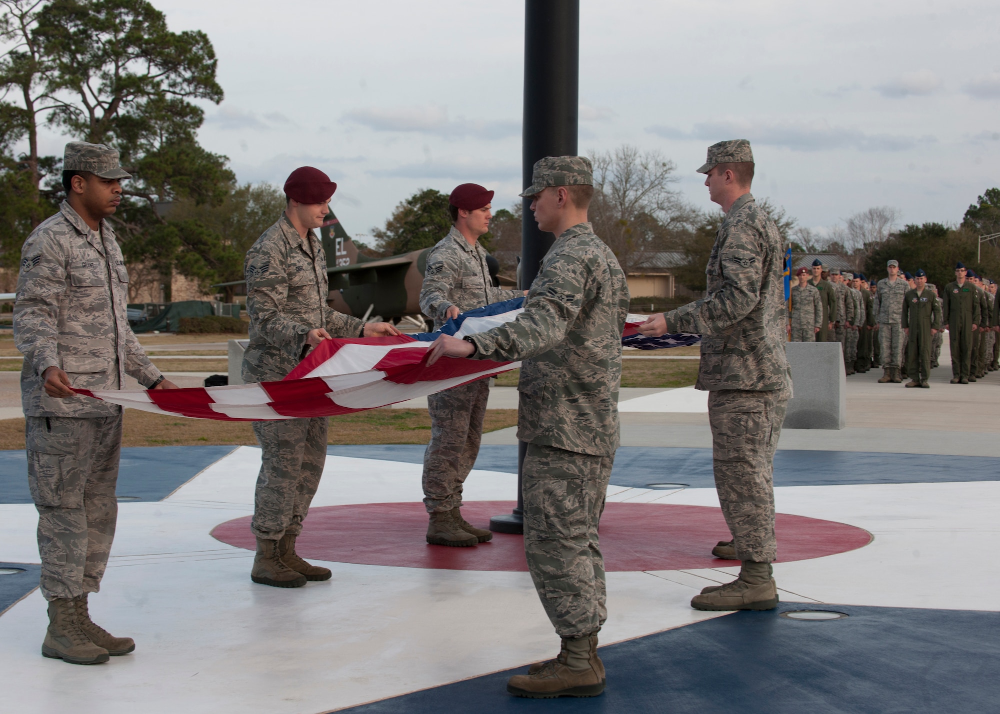 Airmen of the 347th Rescue Group fold the flag during a retreat ceremony at the President George W. Bush Air Park at Moody Field Feb. 21, 2012 at Moody Air Force Base, Ga. The ceremony was the first for the 347th RQG to perform as a group, and will be conducted every month to pay respect to the flag by different members of the 23d Wing. (U.S. Air Force photo by Senior Airman Eileen Meier/Released)