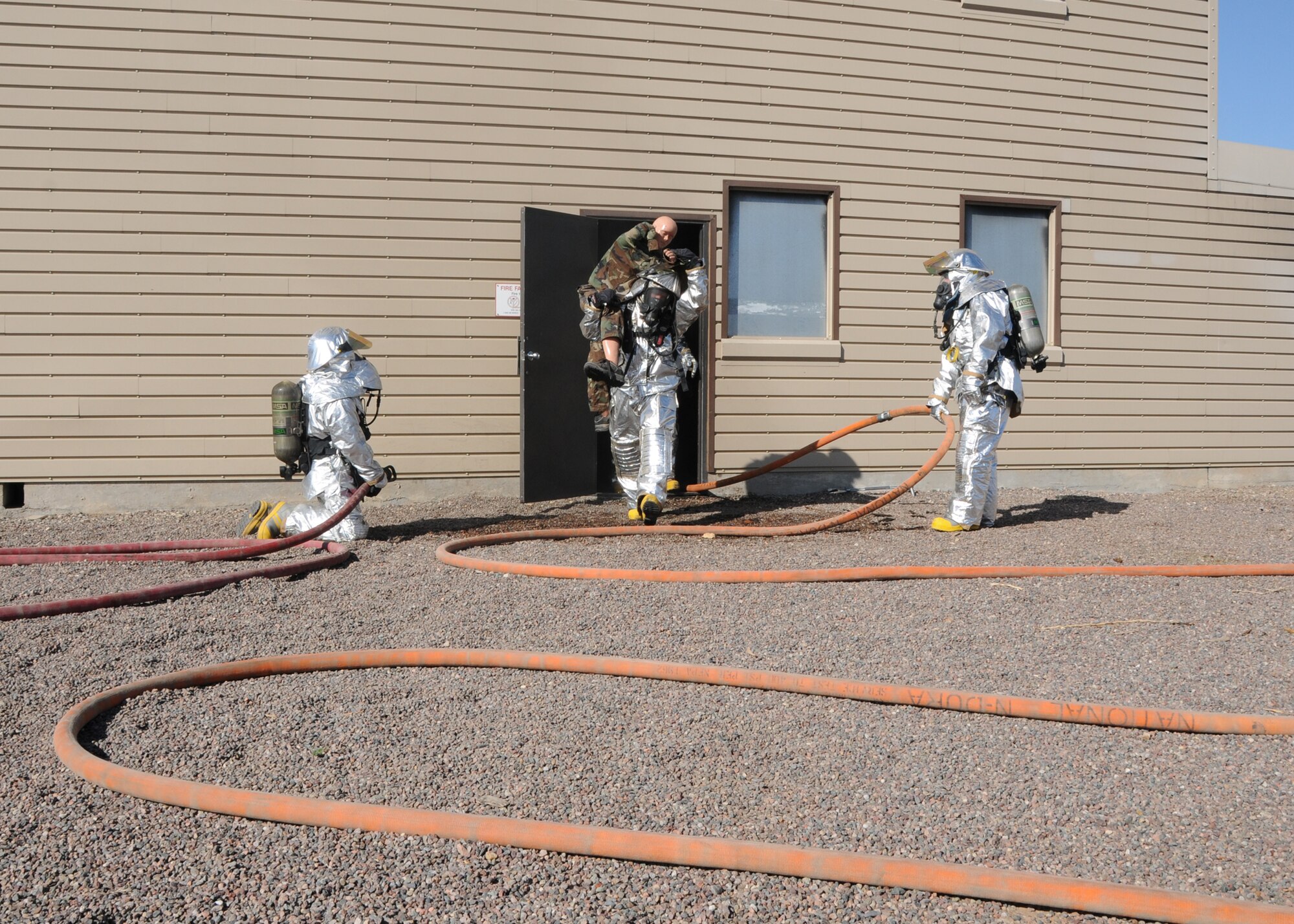 The 944th Civil Engineer Squadron firefighters practice fire rescue as part
of their annual training requirements during the February Unit Training
Assembly.  (U.S. Air Force photo/Staff Sgt. Louis Vega Jr.)
