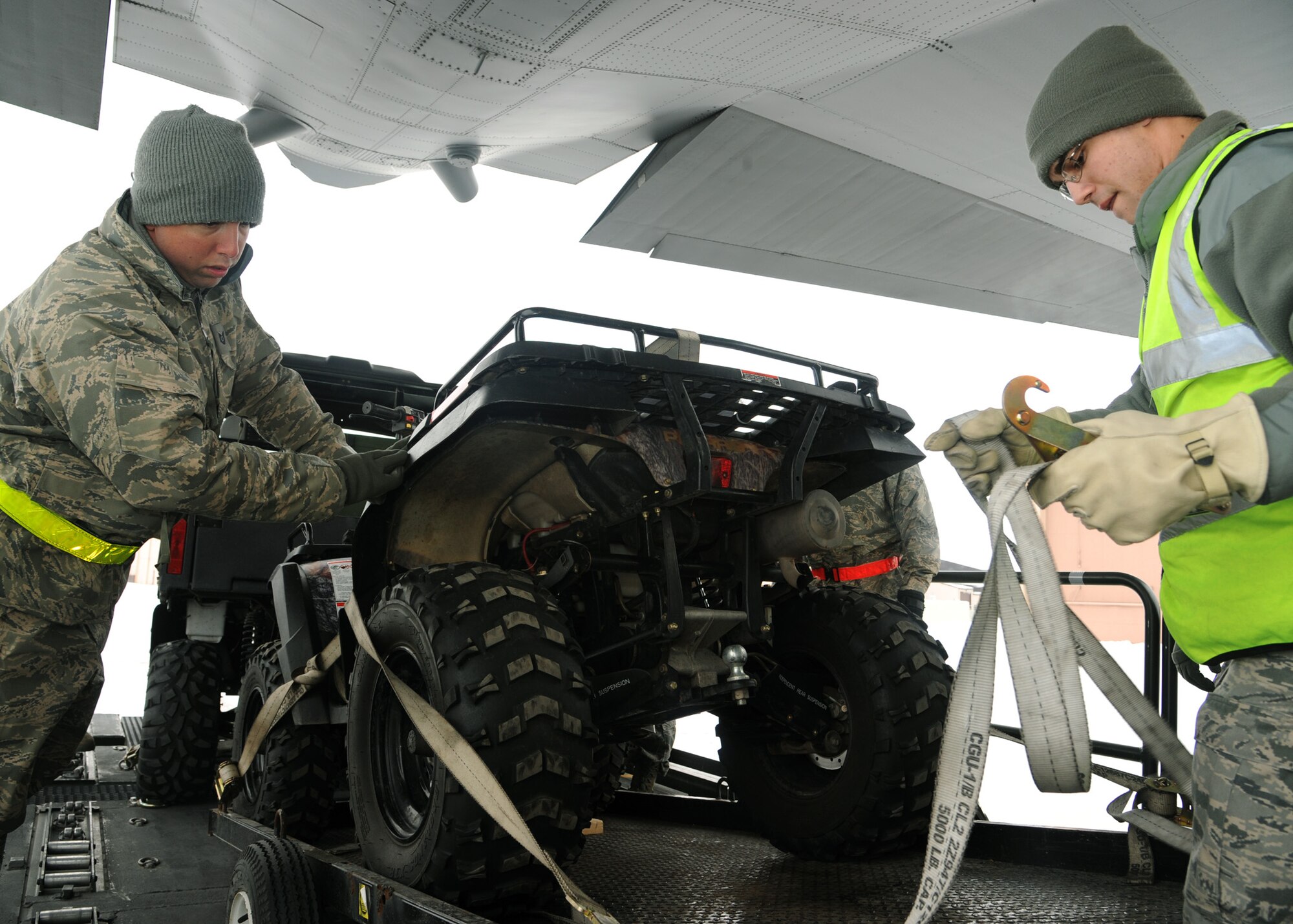 Tech. Sgt. Kevin Reiter, left, and Airman 1st Class Will D’amico, members of the 319th Logistics Readiness Squadron, secure an all terrain vehicle during loadmaster training on a C-130 Hercules on Feb. 22,2012, on Grand Forks Air Force Base, N.D.  The purpose of the training was to help Airmen develop their skills and gain more experience on correctly loading and unloading cargo on and off live aircraft.  (U.S. Air Force photo/Senior Airman Amber Bennet)