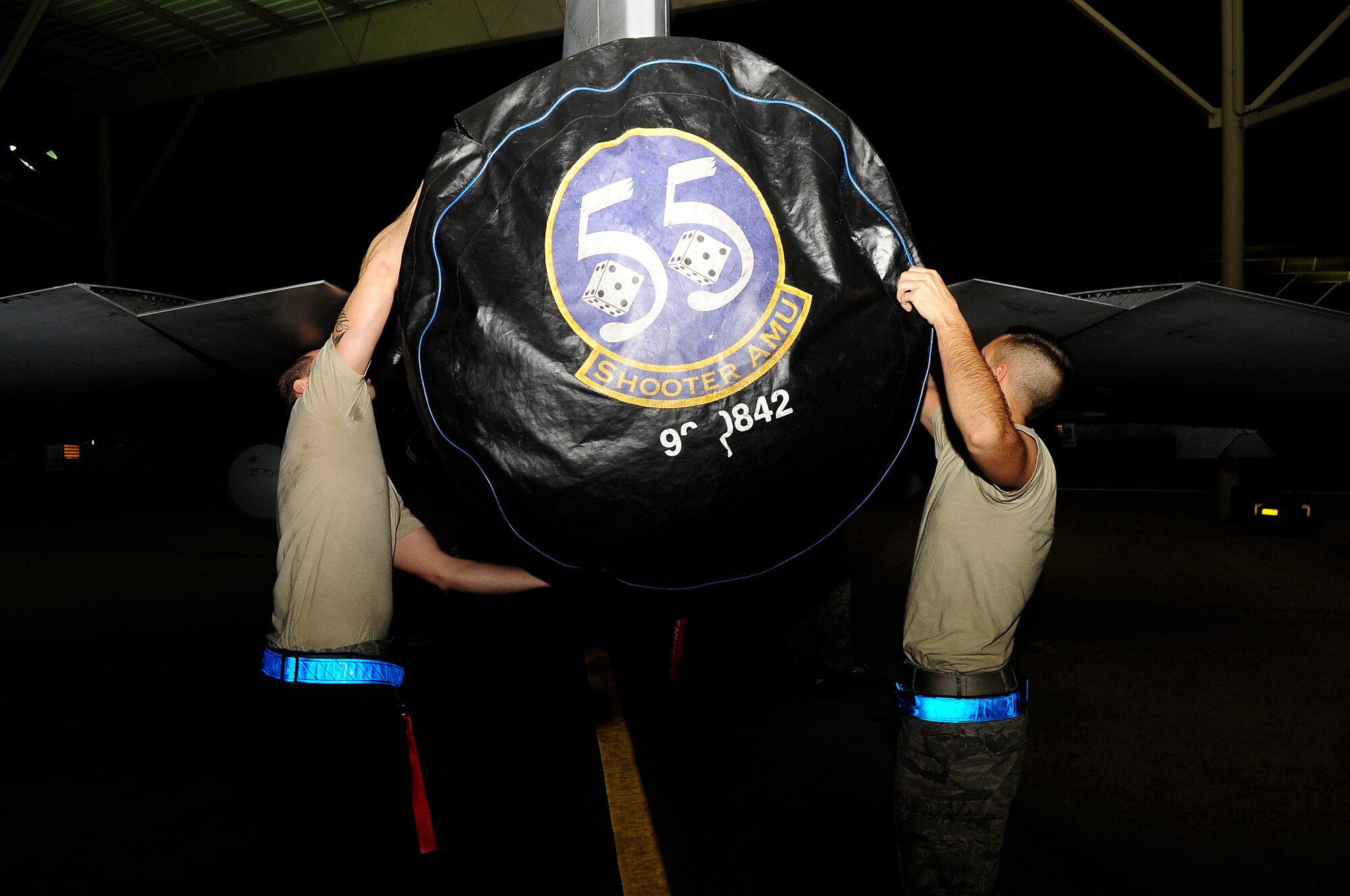 U.S. Air Force Senior Airman Aaron Simonson and Senior Airman Kenneth Cordova, both 20th Aircraft Maintenance Squadron crew chiefs, place a cover over the thruster of an F-16 Fighting Falcon after completing an engine run at Shaw Air Force Base, S.C., Feb. 23, 2012. The 20th AMXS Airmen work around the clock to ensure Shaw’s F-16 fleet is prepared for all training and real world missions.  (U.S. Air Force photo by Airman 1st Class Hunter Brady/Released)