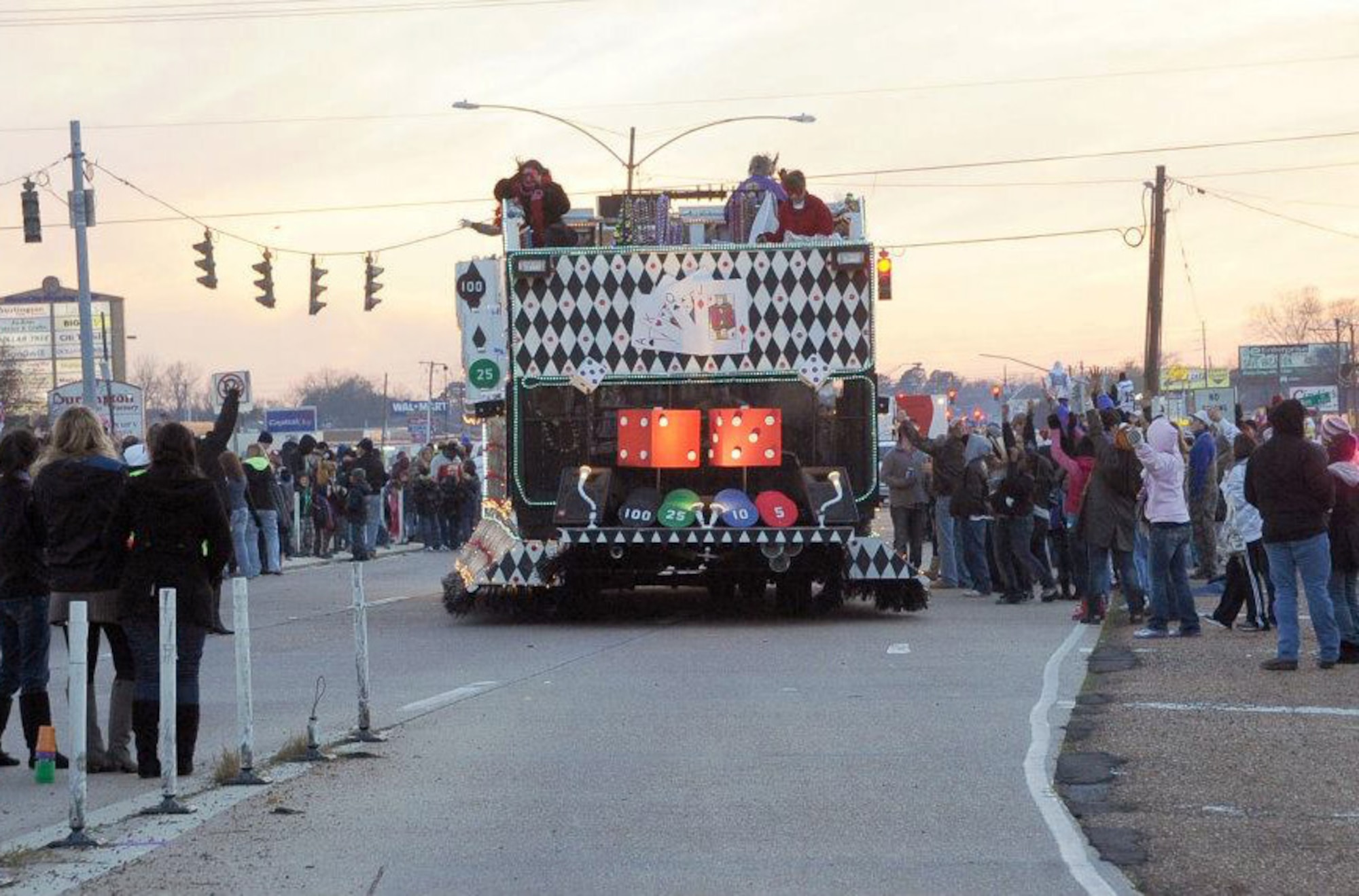 Krewe of Centaur members toss beads and souvenirs to a waiting crowd during the parade in Shreveport, La., Feb. 11. Thousands of local and Barksdale Air Force Base residents attended the parade which showcased more than 50 floats for the Mardi Gras celebration. (U.S. Air Force photo/Senior Airman Amber Ashcraft)(RELEASED)
