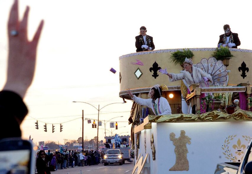 Krewe of Centaur Parade members toss beads and souvenirs to a waiting crowd during the parade in Shreveport, La., Feb. 11. Thousands of local and Barksdale Air Force Base residents attended the parade which showcased more than 50 floats for the Mardi Gras celebration. (U.S. Air Force photo/Senior Airman Amber Ashcraft)(RELEASED)