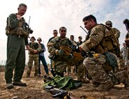 Senior Airmen John Flagg (middle) and Ramon Torres, of the 919th Security Forces Squadron, explain their evidence gathering procedures to Brig. Gen. William Binger, the 10th Air Force commander, after a prisoner recovery exercise Feb. 23, at Duke Field, Fla.  Binger rode with the 919th Airmen during the assault on the compound and entered the building with the fire team.  He was given a first-hand view of the evidence collection procedures performed throughout the building after it was secured and the prisoner was recovered.  (U.S. Air Force photo/Tech. Sgt. Samuel King Jr.)