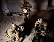 Airmen with the 919th Security Forces Squadron gather up their evidence to leave the building after a prisoner recovery exercise at Duke Field, Fla., Feb. 23.  Airmen executed the procedure for Brig. Gen. William Binger, the 10th Air Force commander, during his visit to the base.  Binger rode with the 919th Airmen during the assault on the compound and entered the building with the fire team.  He was given a first-hand view of the evidence collection procedures performed throughout the building after it was secured and the prisoner was recovered.  (U.S. Air Force photo/Tech. Sgt. Samuel King Jr.)