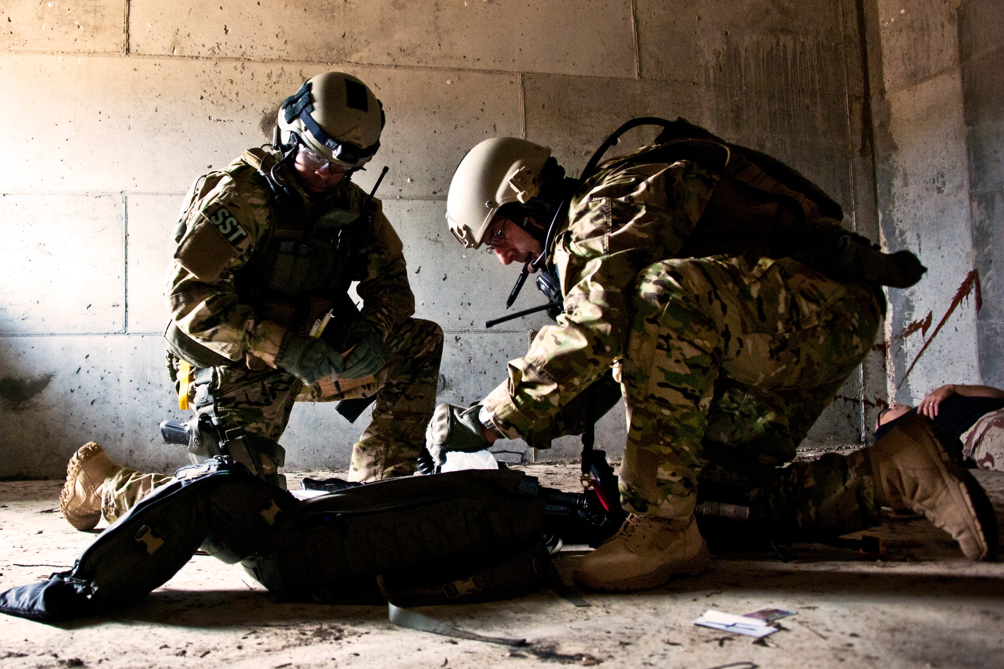 Senior Airman John Flagg and Tech. Sgt. Stephan Tterlikkis, of the 919th Security Forces Squadron, collect and secure evidence after a prisoner recovery exercise at Duke Field, Fla., Feb. 23.  Airmen executed the procedure for Brig. Gen. William Binger, the 10th Air Force commander, during his visit to the base.  Binger rode with the 919th Airmen during the assault on the compound and entered the building with the fire team.  He was given a first-hand view of the evidence collection procedures performed throughout the building after it was secured and the prisoner was recovered.  (U.S. Air Force photo/Tech. Sgt. Samuel King Jr.)