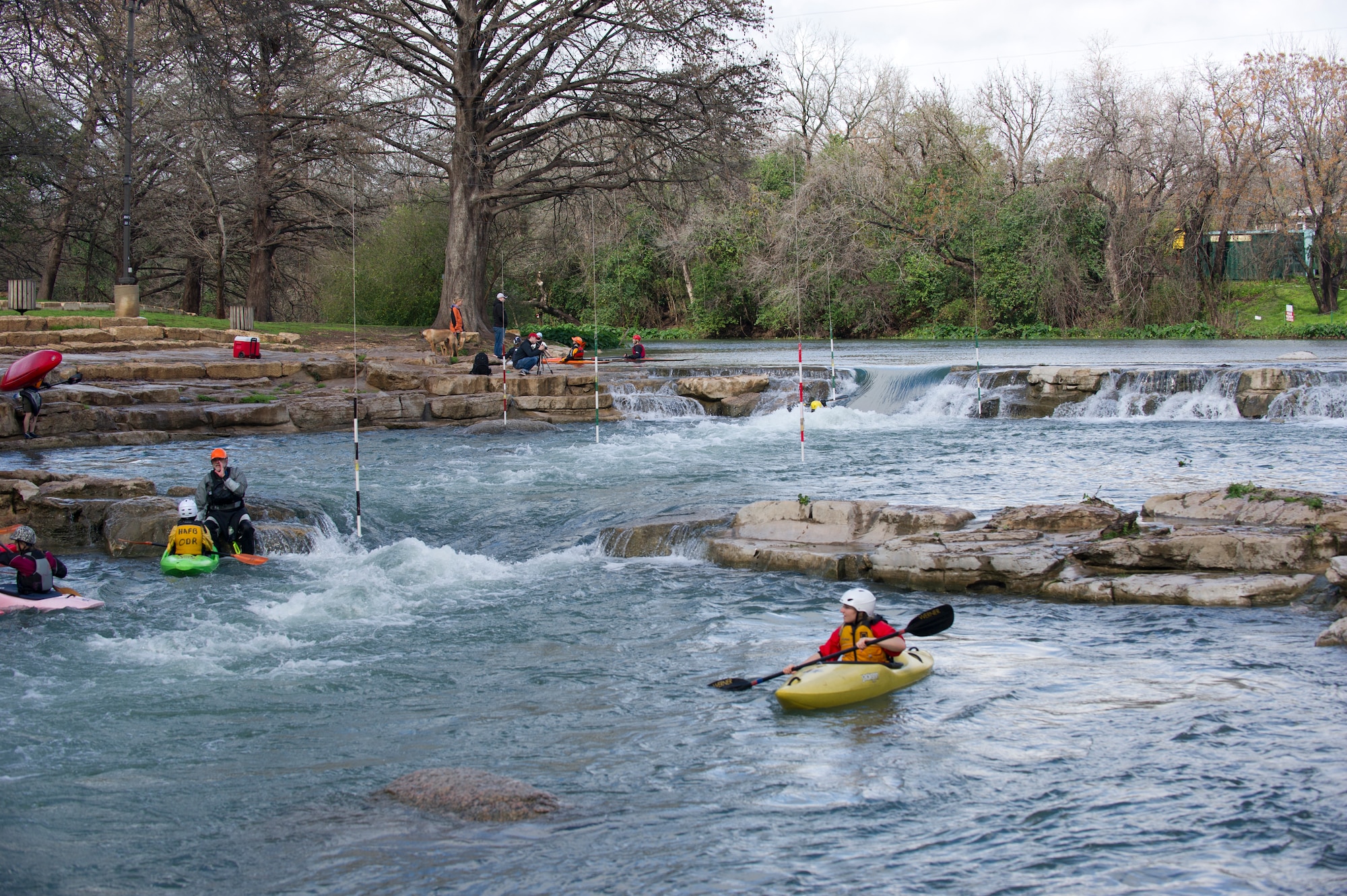 SAN MARCOS, Texas –- The San Marcos River bustles with activity here Feb. 19. Airmen a spouse and a civilian participating in the Holloman Outdoor Wingman Program came to San Marcos to gain a basic understanding of the principles of kayaking and to learn to apply the same critical thinking skills to everyday life. Each Airman, spouse and civilian walked away with a better understanding of both how to manage themselves on a white-water rapid and how to cope through the stress of work in a healthy way. (U.S. Air Force photo by Airman 1st Class Daniel E. Liddicoet/Released)