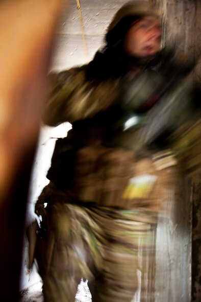 A 919th Security Forces Squadron Airman follows his fire team into a room during a prisoner recovery exercise at Duke Field, Fla., Feb. 23.  Airmen executed the procedure for Brig. Gen. William Binger, the 10th Air Force commander, during his visit to the base.  Binger rode with the 919th Airmen during the assault on the compound and entered the building with the fire team.  He was given a first-hand view of the evidence collection procedures performed throughout the building after it was secured and the prisoner was recovered.  (U.S. Air Force photo/Tech. Sgt. Samuel King Jr.)