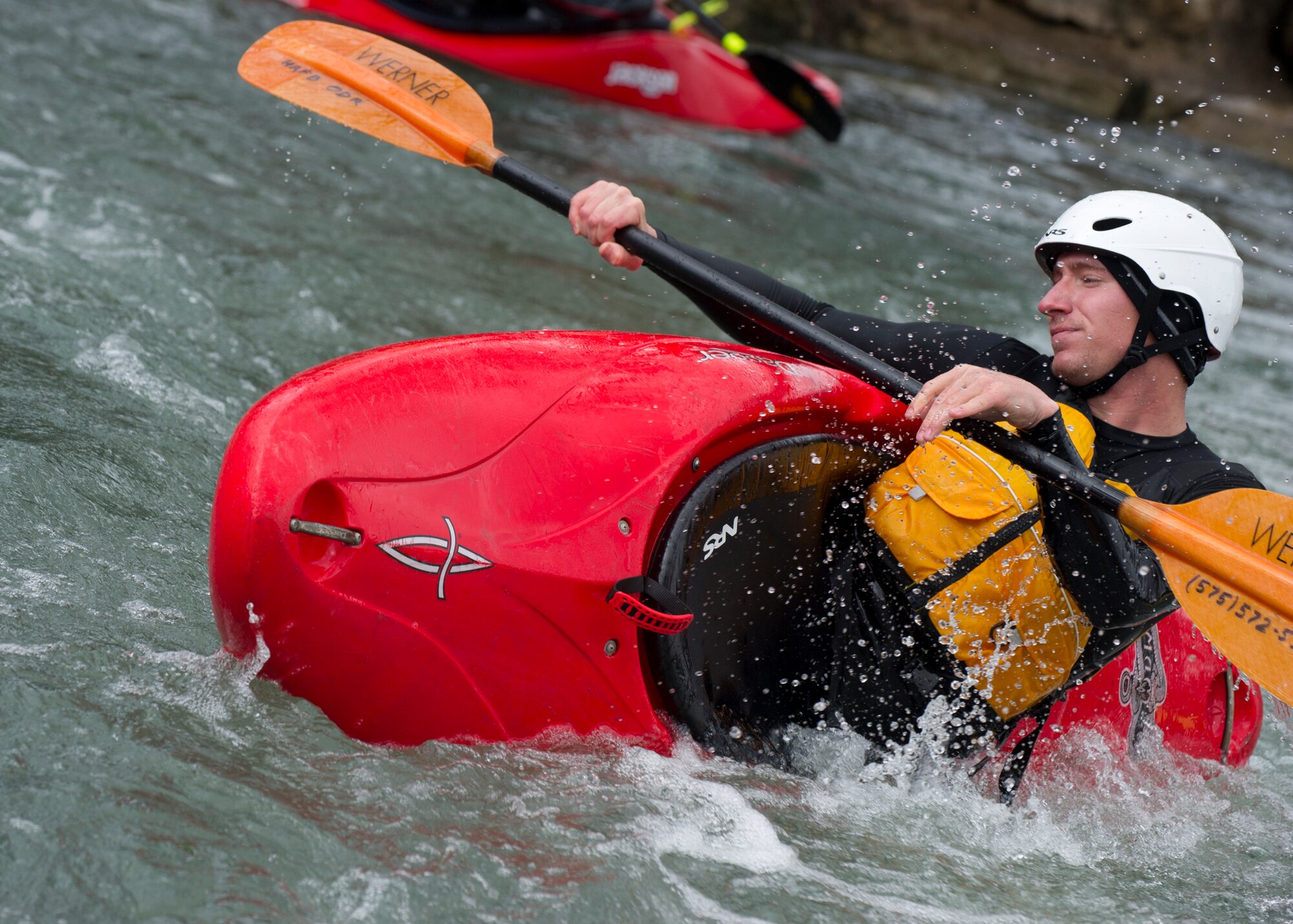 SAN MARCOS, Texas –- U.S. Air Force Senior Airman Justin Boyce, heating ventilation and air conditioning maintainer with the 49th Civil Engineer Squadron, rolls his kayak from underwater here Feb. 19. Rolling was one the primary skills learned by Airmen a spouse and a civilian participating in Outdoor Recreation’s kayaking trip to San Marcos. Knowing how to roll allows paddlers to take on more challenging rapids without the fear of flipping and not being able to get upright. Each Airman, spouse and civilian on the trip walked away with a better understanding of both how to manage themselves on a white-water rapid and how to cope through the stress of work in a healthy way. (U.S. Air Force photo by Airman 1st Class Daniel E. Liddicoet/Released)