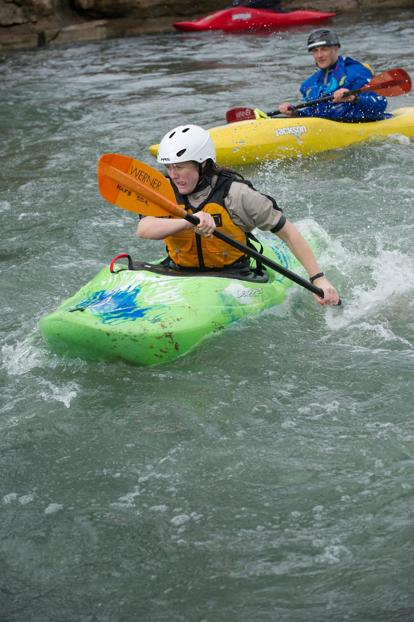 SAN MARCOS, Texas –- Ben Kvanli, former Olympian and current kayaking instructor with the Red River Racing Team, encourages Kelley Liddicoet, an Air Force spouse, as she prepares to charge her boat down a waterfall here Feb. 19. Airmen a spouse and a civilian participating in the Holloman Outdoor Wingman Program came to San Marcos to gain a basic understanding of the principles of kayaking and to learn to apply the same critical thinking skills to everyday life. Each Airman, spouse and civilian walked away with a better understanding of both how to manage themselves on a white-water rapid and how to cope through the stress of work in a healthy way. (U.S. Air Force photo by Airman 1st Class Daniel E. Liddicoet/Released)