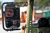 Senior Airman Daniel Logvin, of the 919th Security Forces Squadron, waits for word to roll out for the mission at Duke Field, Fla., Feb. 23.  Security forces Airmen performed a prisoner recovery exercise for Brig. Gen. William Binger, the 10th Air Force commander, during his visit to the base.  Binger rode with the 919th Airmen during the assault on the compound and entered the building with the fire team.  He was given a first-hand view of the evidence collection procedures performed throughout the building after it was secured and the prisoner was recovered.  (U.S. Air Force photo/Tech. Sgt. Samuel King Jr.)