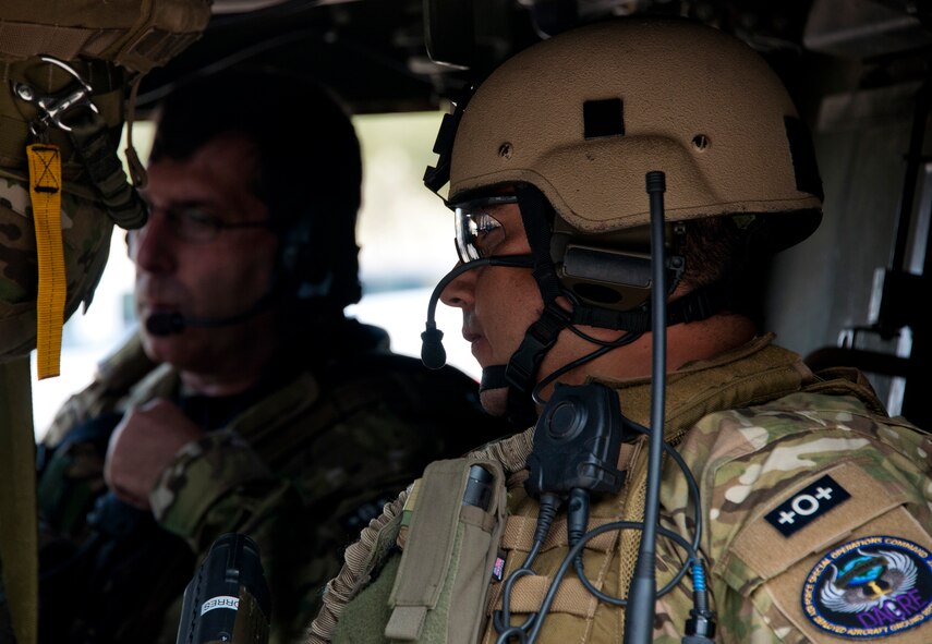 Senior Airman Ramon Torres and Tech. Sgt. Stephan Tterlikkis, of the 919th Security Forces Squadron, wait to roll out for the mission at Duke Field, Fla., Feb. 23.  Security forces Airmen performed a prisoner recovery exercise for Brig. Gen. William Binger, the 10th Air Force commander, during his visit to the base.  Binger rode with the 919th Airmen during the assault on the compound and entered the building with the fire team.  He was given a first-hand view of the evidence collection procedures performed throughout the building after it was secured and the prisoner was recovered.  (U.S. Air Force photo/Samuel King Jr.)