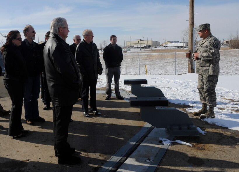 MINOT AIR FORCE BASE, N.D. – Tech. Sgt. Javier Martinez 91st Maintenance Operations Squadron E-Lab technician, conducts a tour of the above ground portion of the Uniform 0-1 launch facility trainer here Feb. 15. The tour provided civic leaders with an inside look at the 91st Missile Wing's daily training operations as well as an overview of the weapons systems it is responsible for overseeing. (U.S. Air Force photo/Airman 1st Class Stephanie Ashley)