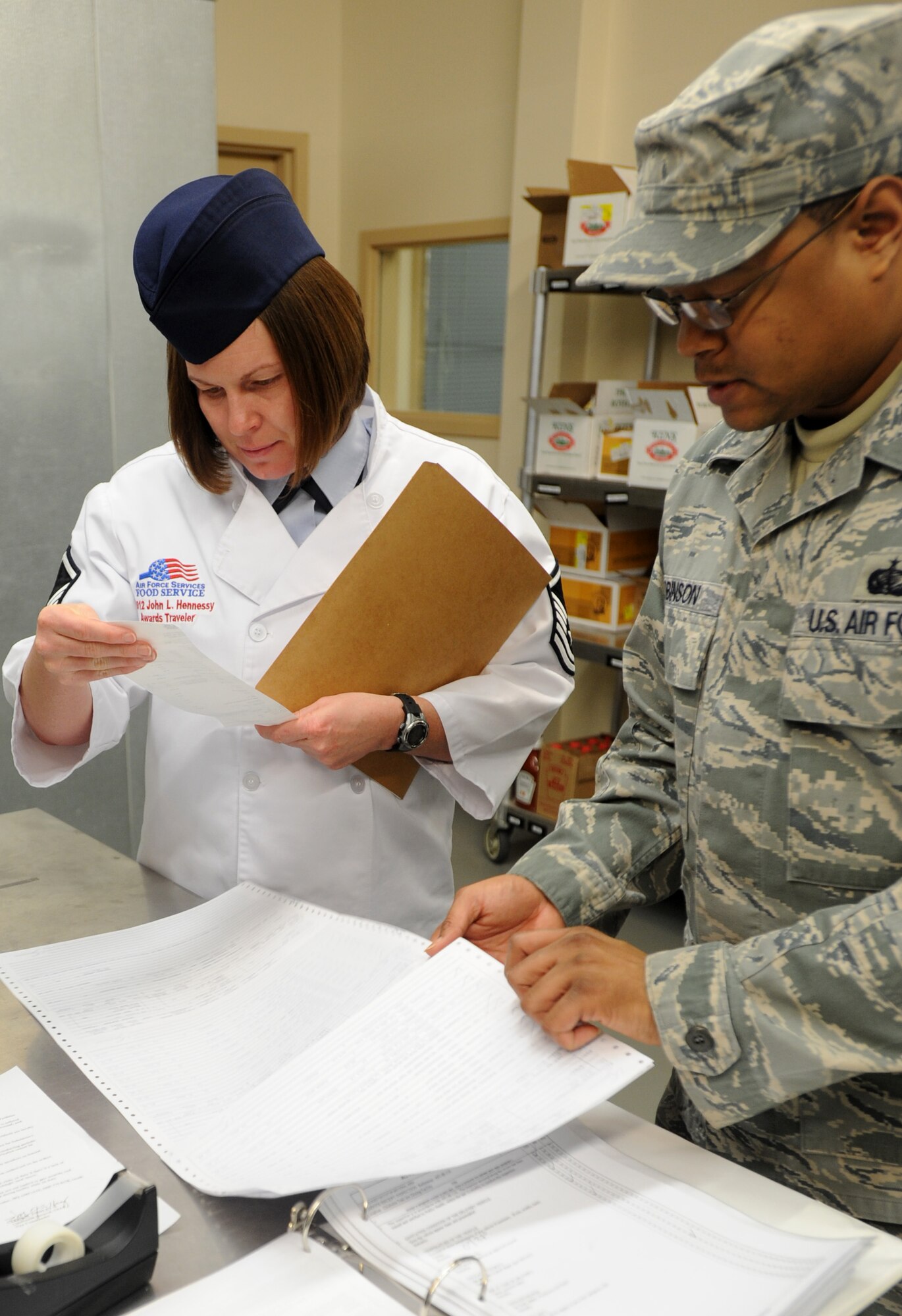 Master Sgt. Stephanie Thomas, Hennessy Evaluation Team team leader, looks over a delivery receipt for the Chisholm Trail Dining Facility Feb. 22, 2012, McConnell Air Force Base. The facility was Air Mobility Command’s nominee for this year’s John L. Hennessy Trophy Award – a competition that determines the top food service operation in the Air Force. (U.S. photo/ Airman 1st Class Laura L. Valentine)