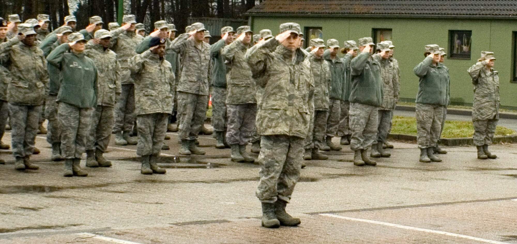 GEILENKIRCHEN NATO AIR BASE, Germany -- Members of the 470th Air Base Squadron here salute the U.S. Flag here Feb. 17 during a retreat ceremony in recognition of Presidents Day. (U.S. Air Force photo by Staff Sgt. Andrew Caber/Released)