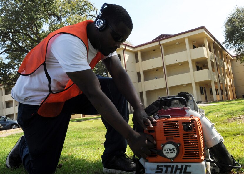 Kendrick Bratton, prepares to turn on a leaf blower on Barksdale Air Force Base, La., Feb. 23. Contractors like Bratton perform a variety of duties on base such as grounds maintenance, landscaping and construction. (U.S. Air Force photo/Airman 1st Class Andrew Moua)(RELEASED)