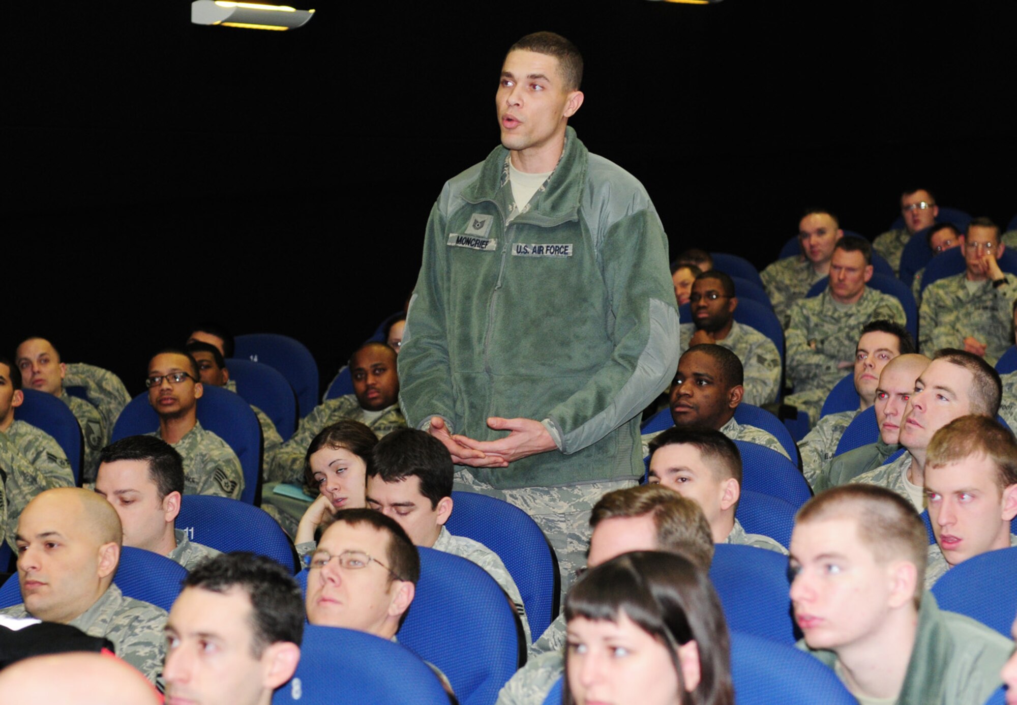 RAF MILDENHALL, England – Tech. Sgt. Kenneth Moncrief, 48th Communications Squadron, asks a question after a briefing given by Col. Nancy P. Reeves-Flores, U.S. Air Forces in Europe director of communications, at the base theater here Feb. 16, 2012. Airmen and civilians from the 100th Communications Squadron, 48th Communications Squadron, 352nd Special Operations Group, 488th Intelligence Squadron and 727th Air Mobility Squadron asked questions on topics including manning, equipment, cuts, Air Force instructions and future operations. (U.S. Air Force photo/Karen Abeyasekere)