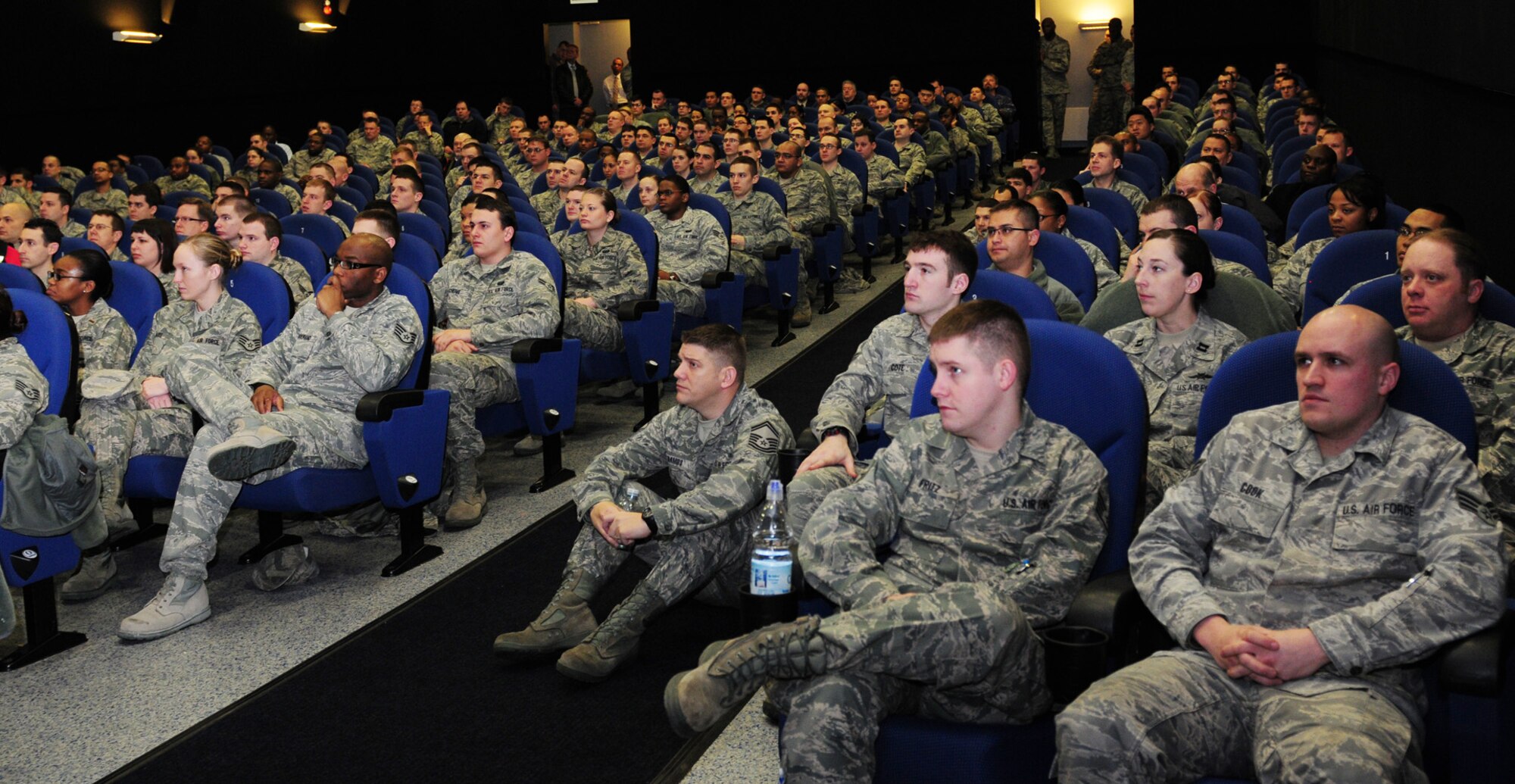 RAF MILDENHALL, England – Communications Airmen from Team Mildenhall and RAF Lakenheath meet at the base theater here  Feb. 16, 2012, for a briefing given by Col. Nancy P. Reeves-Flores, U.S. Air Forces in Europe directior of communications, during her tour of USAFE bases in England. The colonel was here to meet the cyber professionals, talk to them about the future of their career fields, and to answer questions. (U.S. Air Force photo/Karen Abeyasekere)