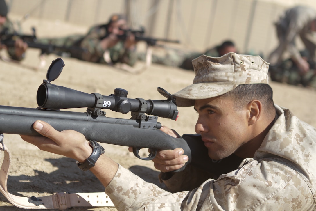Marines and civilian employees at the Yermo annex of Marine Corps Logistics Base Barstow, Calif., stand at attention during the activation ceremony for Marine Depot Maintenance Command in Albany, Ga., Feb 23. The two maintenance plants are now consolidated under the command and control of MDMC.