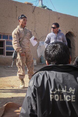 Lance Corporal Niko Azucenas, a police advisor with Regimental Combat Team 5 Police Advisory Team, goes over proper vehicle check point procedures for escalation of force for a class of Afghan Local Police officers here February 24, 2012. Azucenas and his fellow police advisors instructed refresher courses with Afghan police to keep the prepared for their role in providing security here.