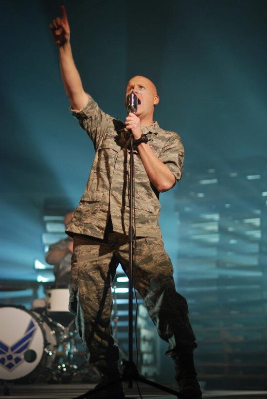 Vocalist Master Sgt. Ryan Carson performs with Max Impact during the production of their "Send Me" video.  U.S. Air Force photo by Master Sgt. Bob Kamholz.