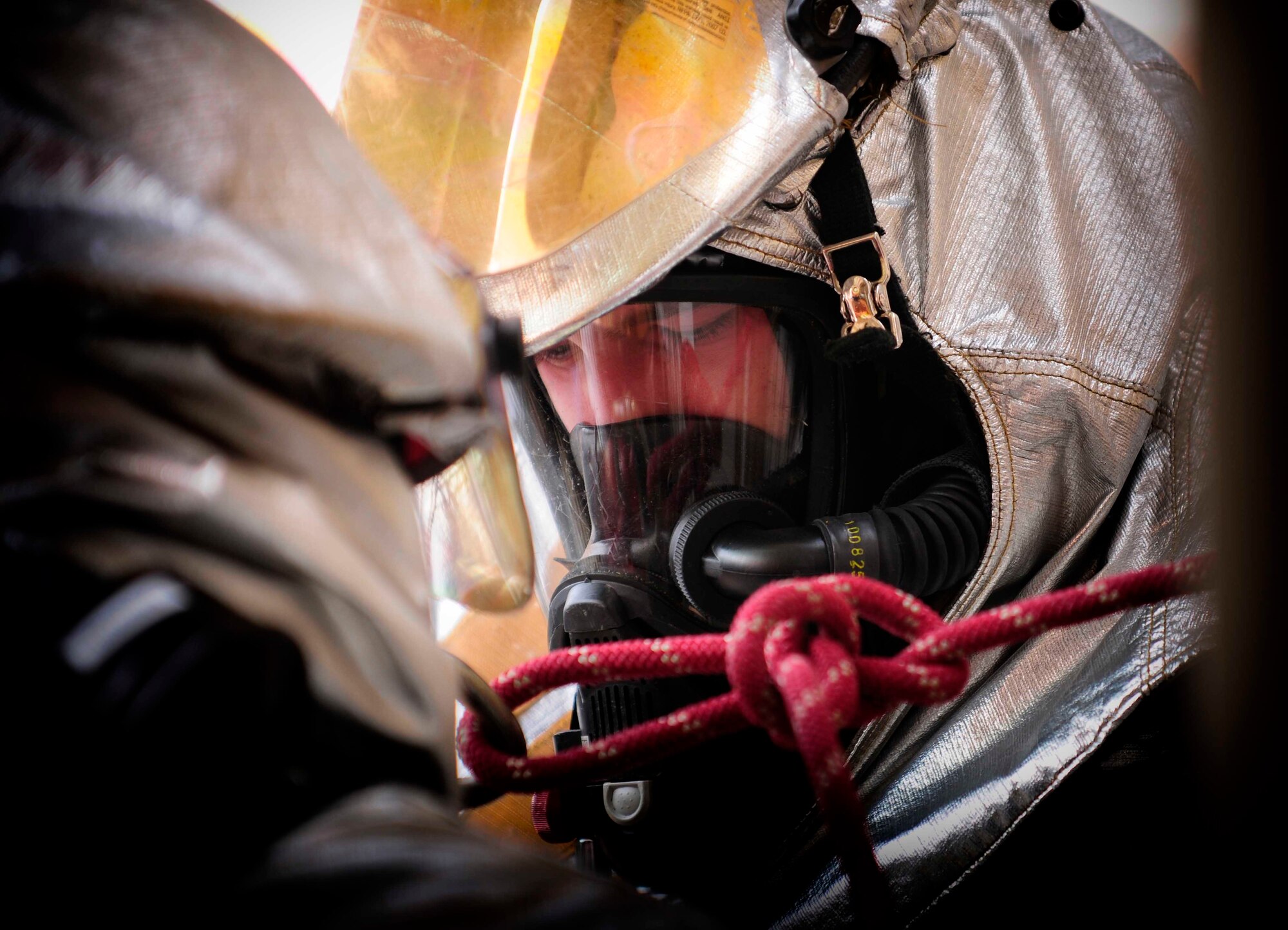 Airman 1st Class Ronald Brown, 31st Civil Engineer Squadron firefighter,
connects two additional lines to a water connection source Feb.23 at Aviano Air 
Base, Italy. The bimonthly training provides great positioning and full fire suppression coverage of the entire building. (U.S. Air Force photo/Airman 1st Class Briana Jones)