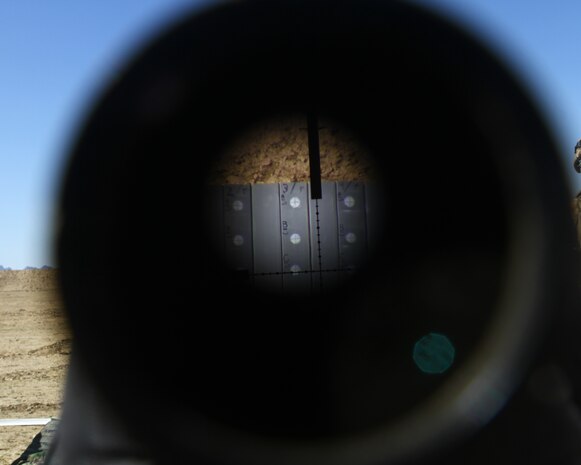 A rifle target is viewed through a monocular during advanced marksmanship training for Afghan National Army soldiers here, Feb. 25. The top shooters from 3rd Kandak, 2nd Brigade, 215th Corps, were selected to learn precision shooting from scout snipers with 2nd Battalion, 4th Marine Regiment. The Marines chose the best students to serve as marksmanship instructors and pass on their new skills to other Afghan soldiers.